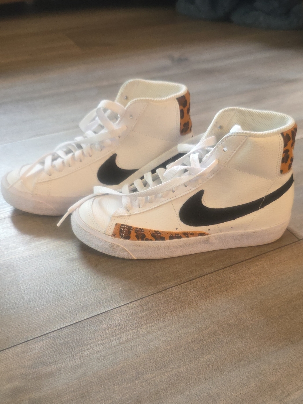 Nike Kids White High-Top Sneakers with Black Swoosh and Leopard Accent